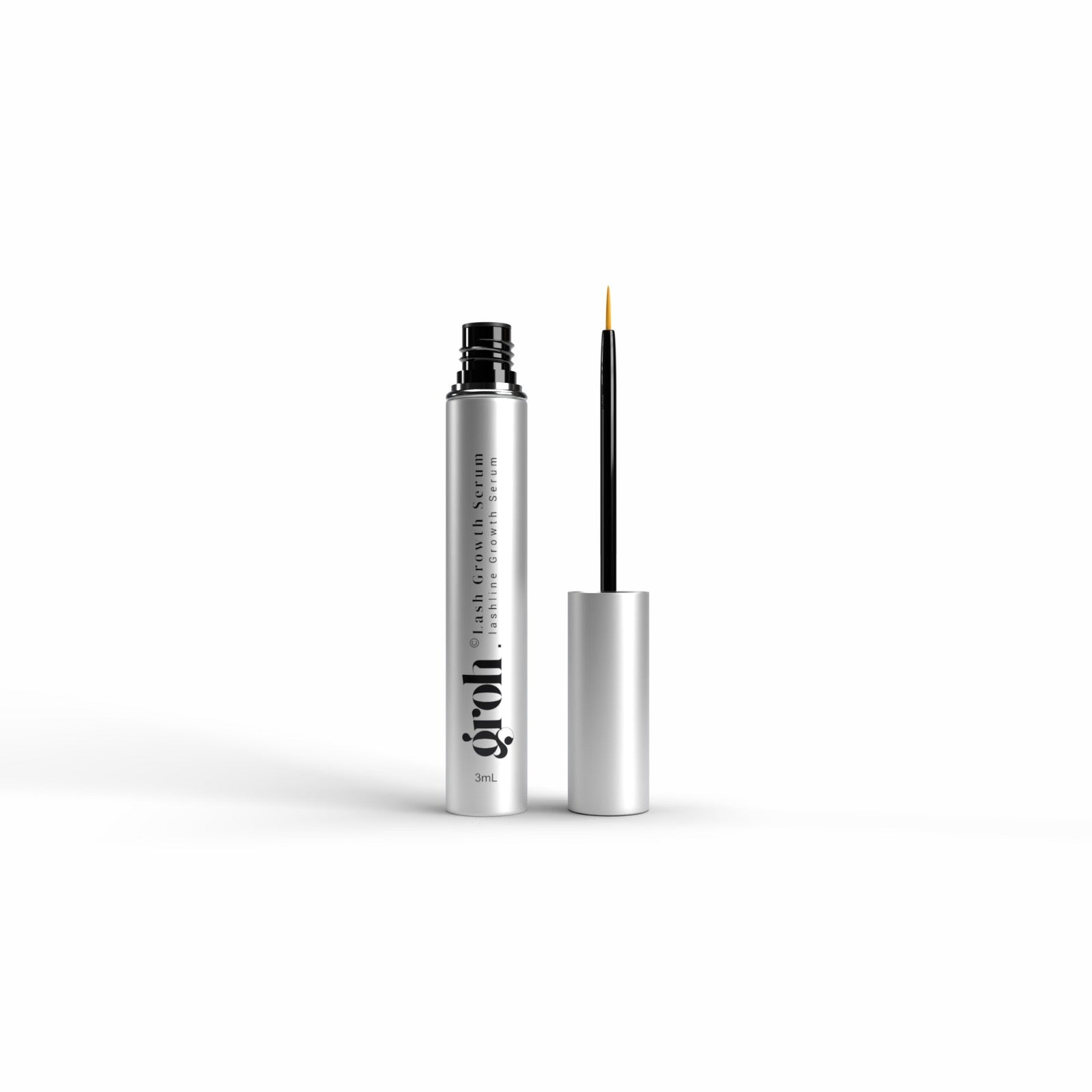 eyelash serum with silver case and black tip on a white background